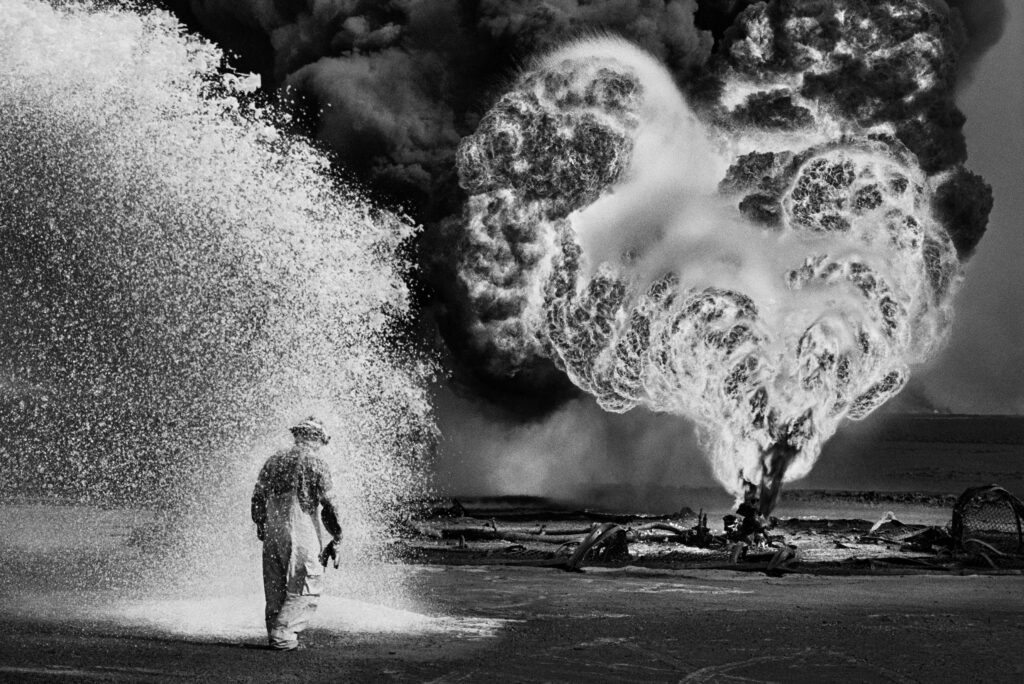Sebastiao Salgado Greater Burhan Oil Field Kuwait 1991 Chemical spray protects firefighter scaled 1 1